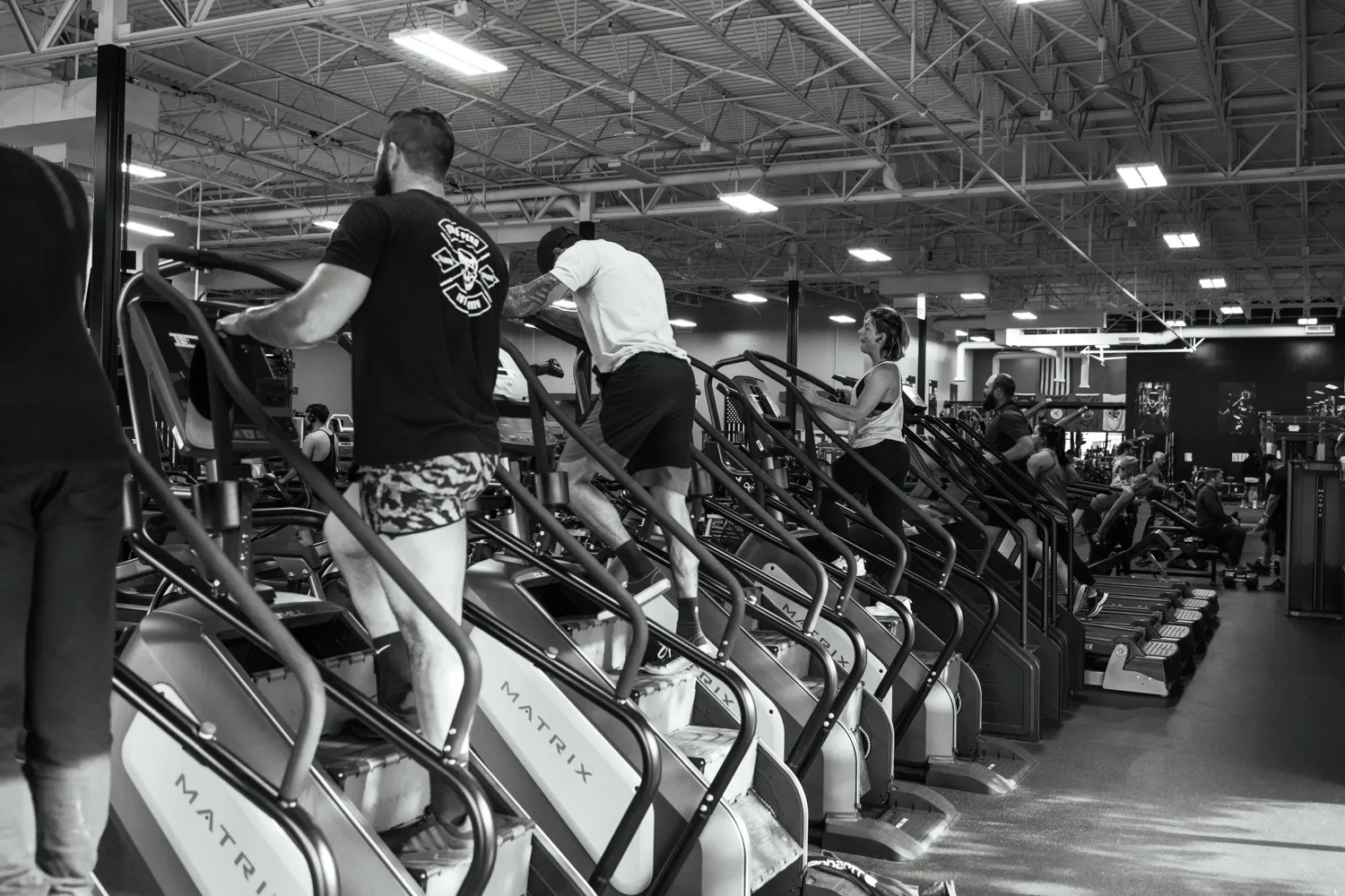 Gym members using cardio machines at The Mecca Gym located in Boise, Idaho.
